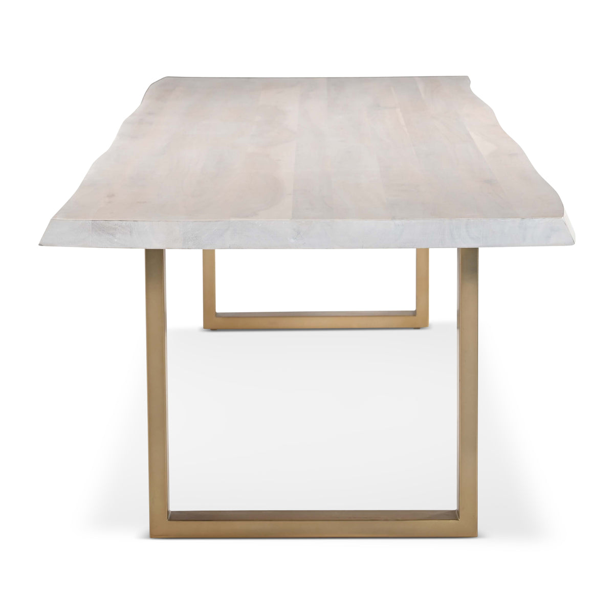 Brooks Dining Table - U Base by Urbia — end-on view of the pale live-edge acacia top and gold-toned U frame