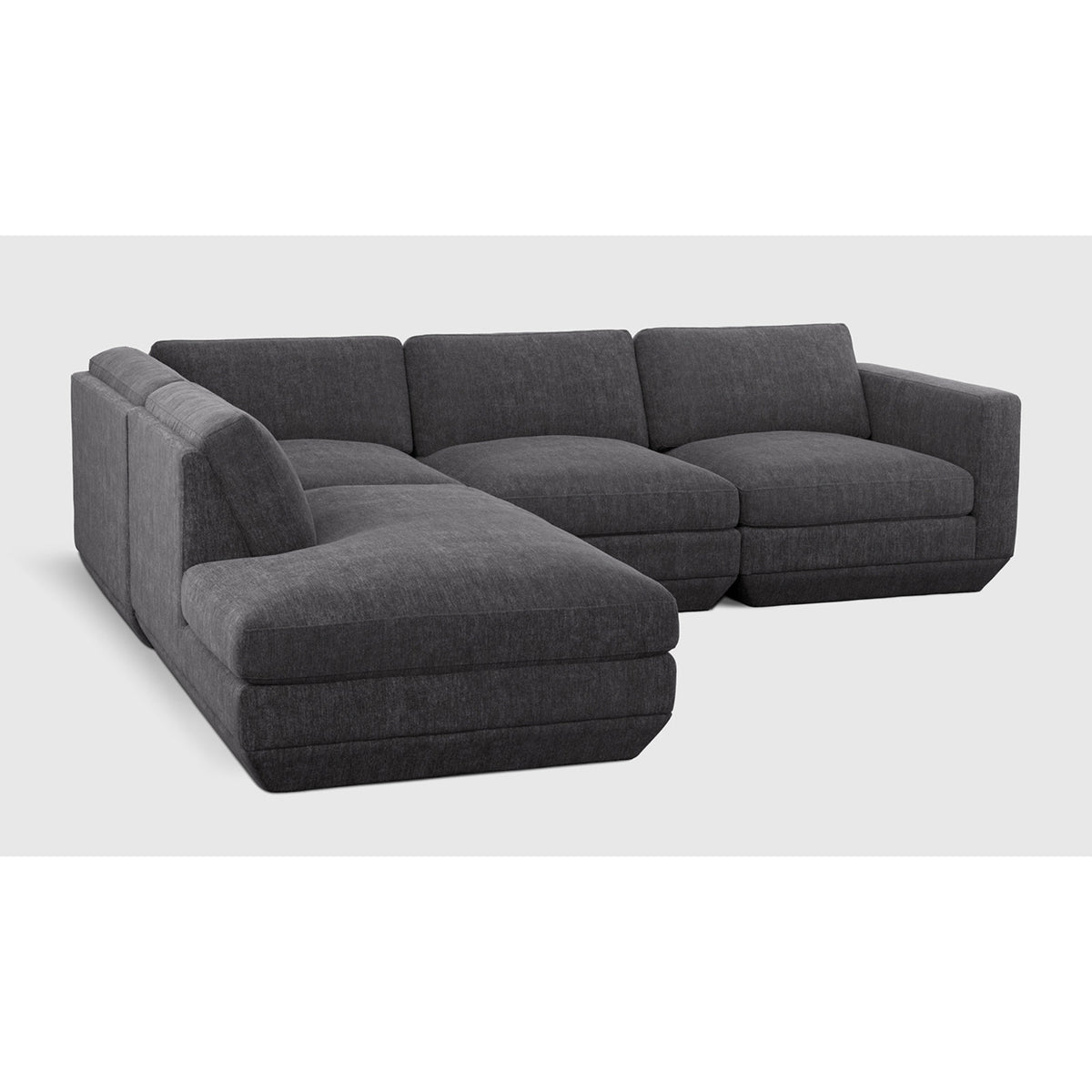 Podium Modular 4PC Lounge Sectional A by Gus* with charcoal upholstery, angled view.