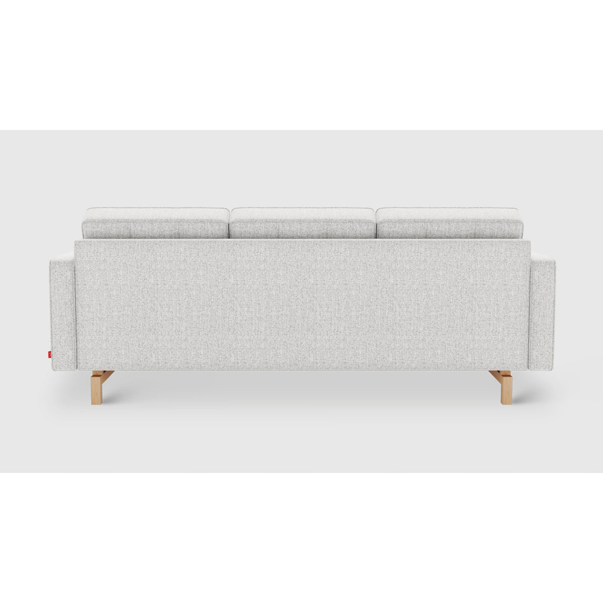 Jane 2 Loft Bi-Sectional by Gus* — straight rear view showing the upholstered back and light wood legs
