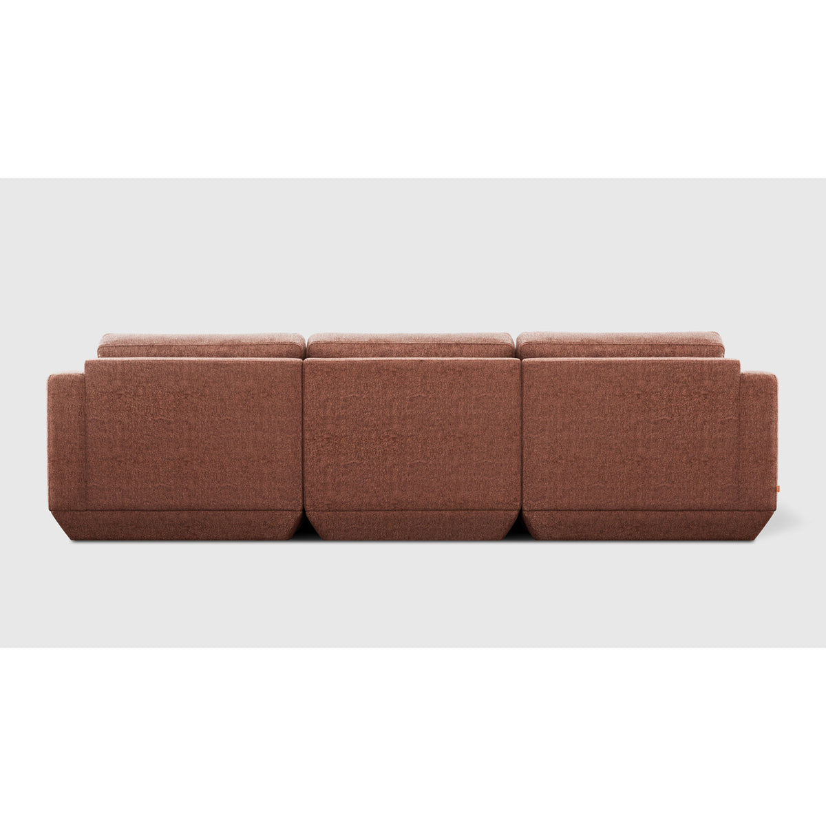 Podium Modular 3PC Sofa by Gus* — rear view in rust-toned upholstery showing three modular back panels