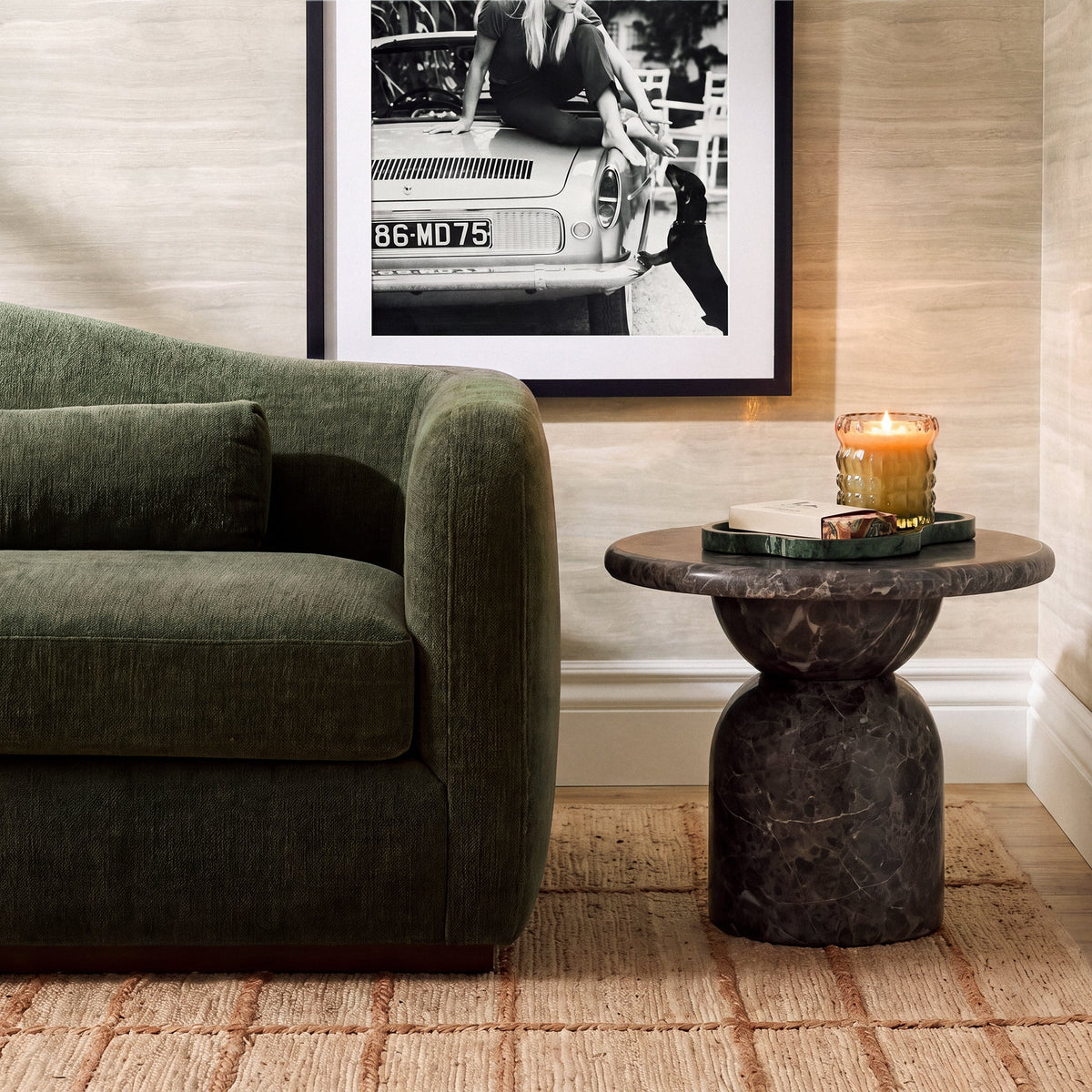 Cynthia Concrete Indoor/Outdoor Side Table by TOV Furniture — dark Emperador marble finish beside a sofa