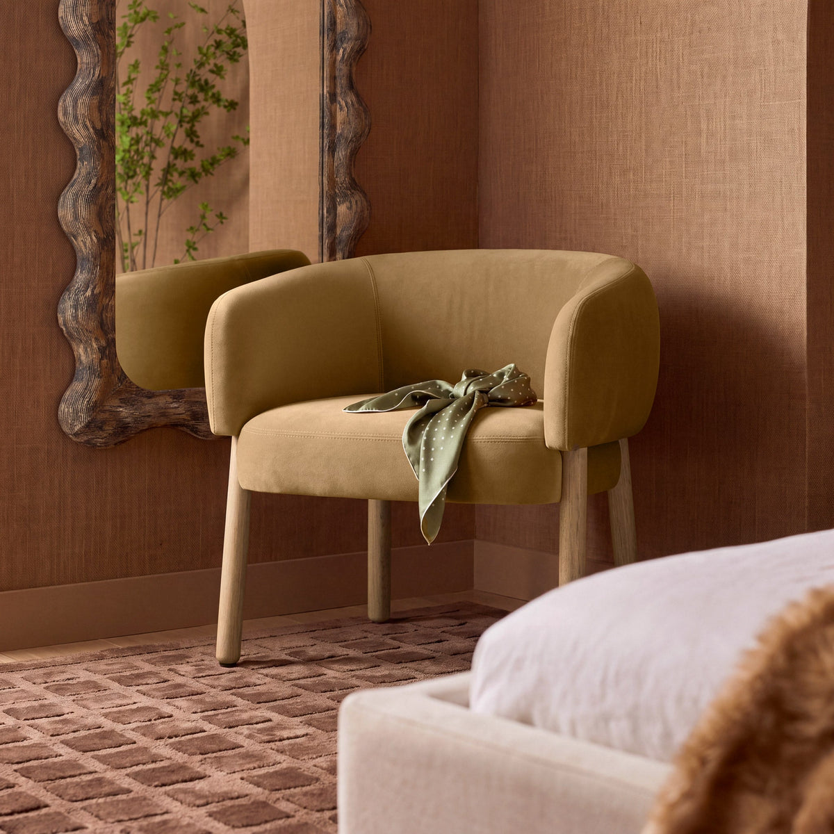Foxy Performance Fabric Accent Chair in Camel — lifestyle view beside a wall mirror