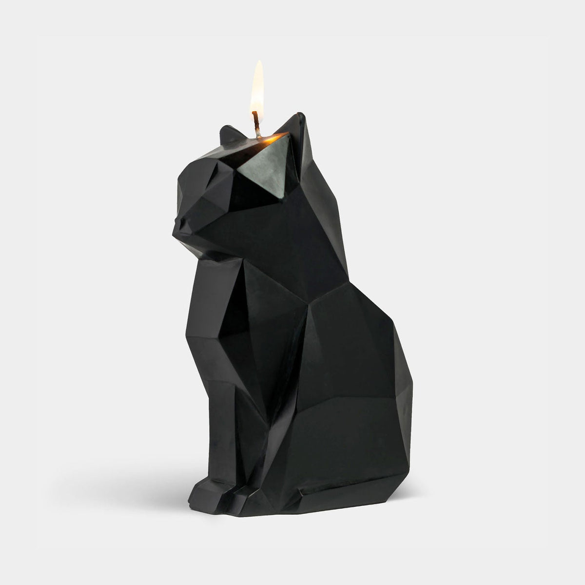 PyroPet Kisa Black cat candle by 54Celsius, lit three-quarter view before the metal skeleton is revealed.