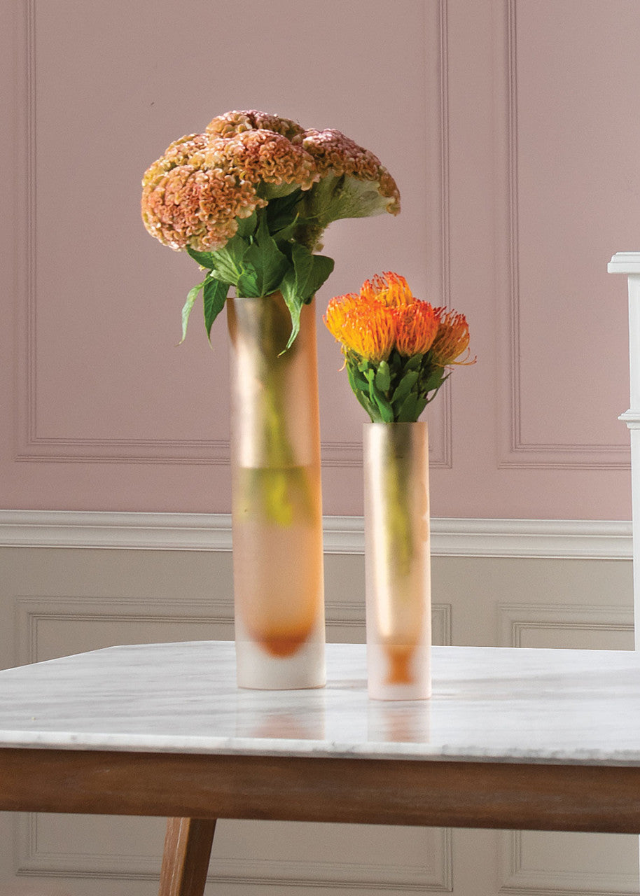 Lungo Large Vase by Villa & House — amber glass vase with flowers beside a smaller coordinating vase on a marble table.