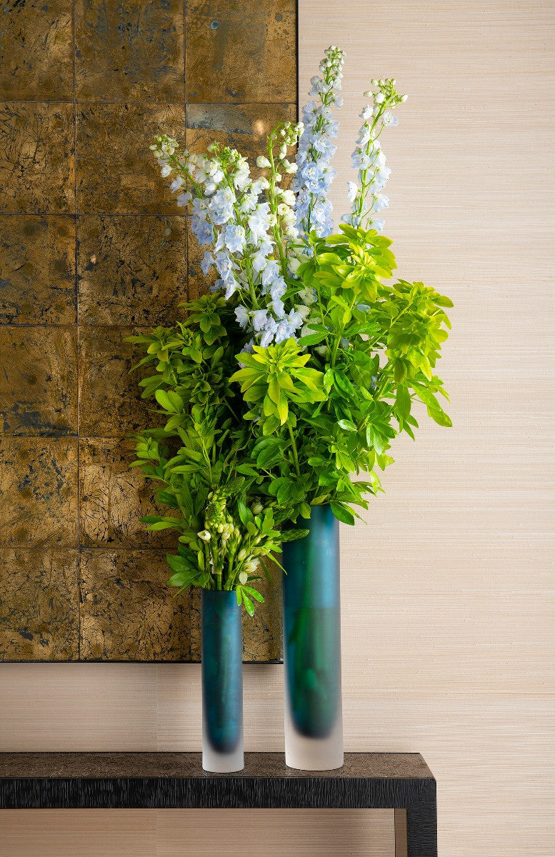 Lungo Large Vase by Villa & House — close lifestyle view of blue glass vases filled with white and green flowers.