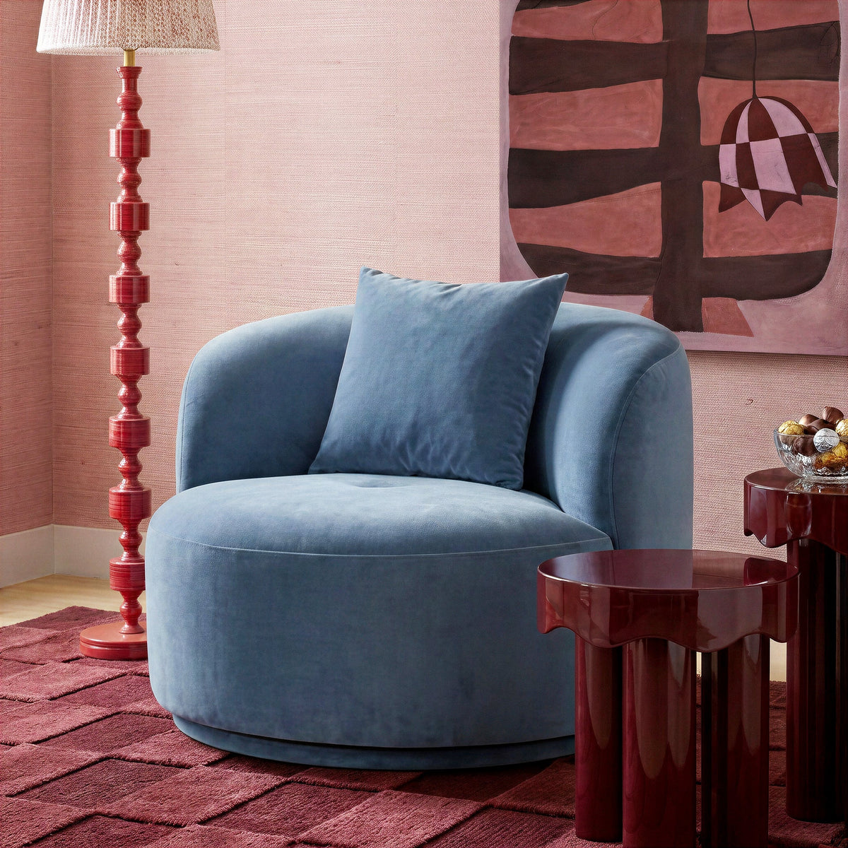 Fickle Swivel Accent Chair in Bluestone — lifestyle view with matching pillow