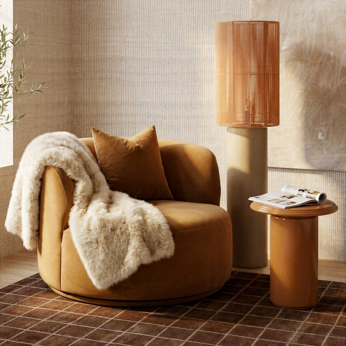 Fickle Swivel Accent Chair in Camel — lifestyle view with matching pillow and draped throw