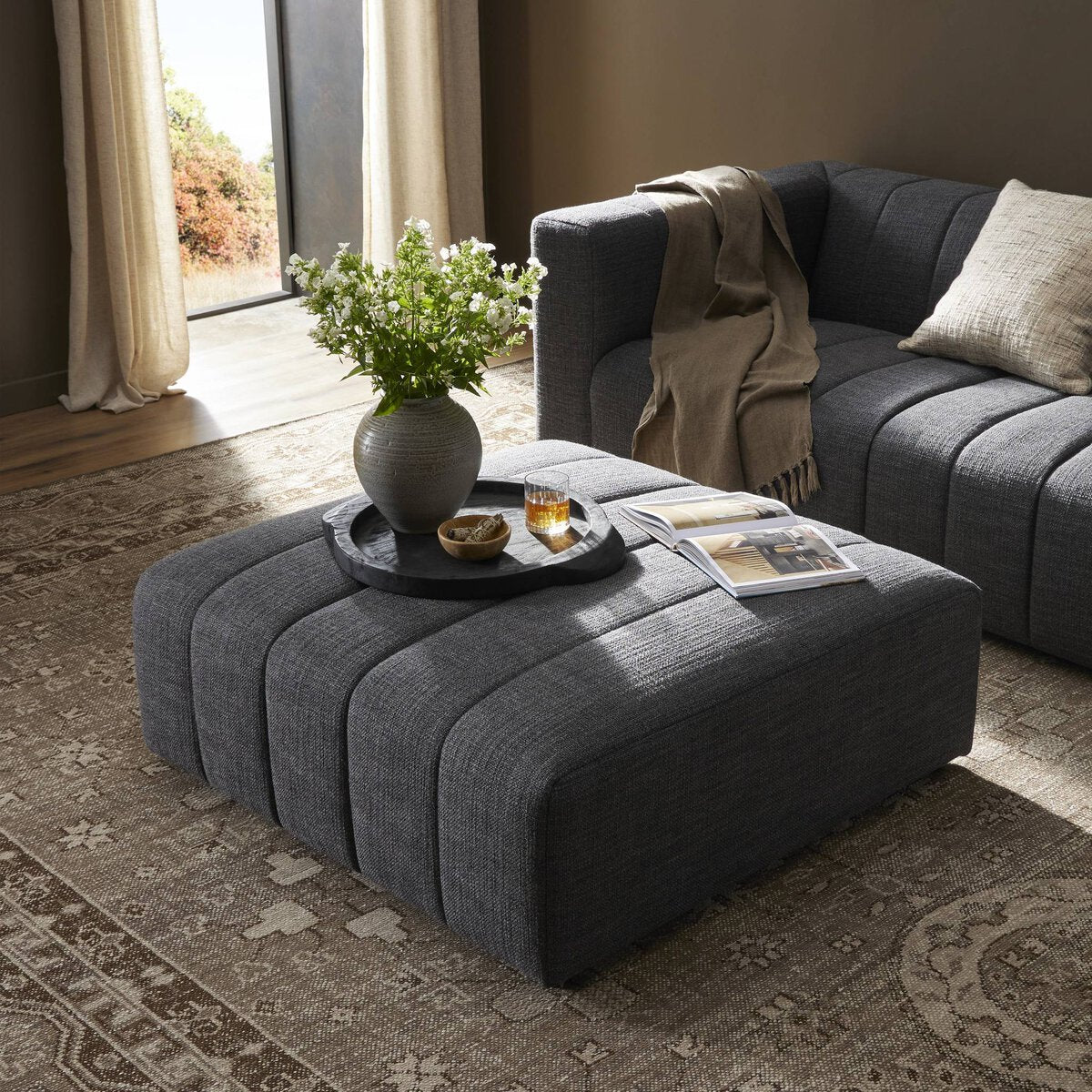 Modern modular sectional in a styled living room — Langham Sectional by Four Hands