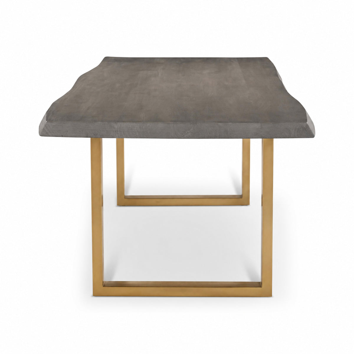 Brooks Dining Table - U Base by Urbia — end view of the dark gray acacia tabletop with warm brass-toned U-shaped supports