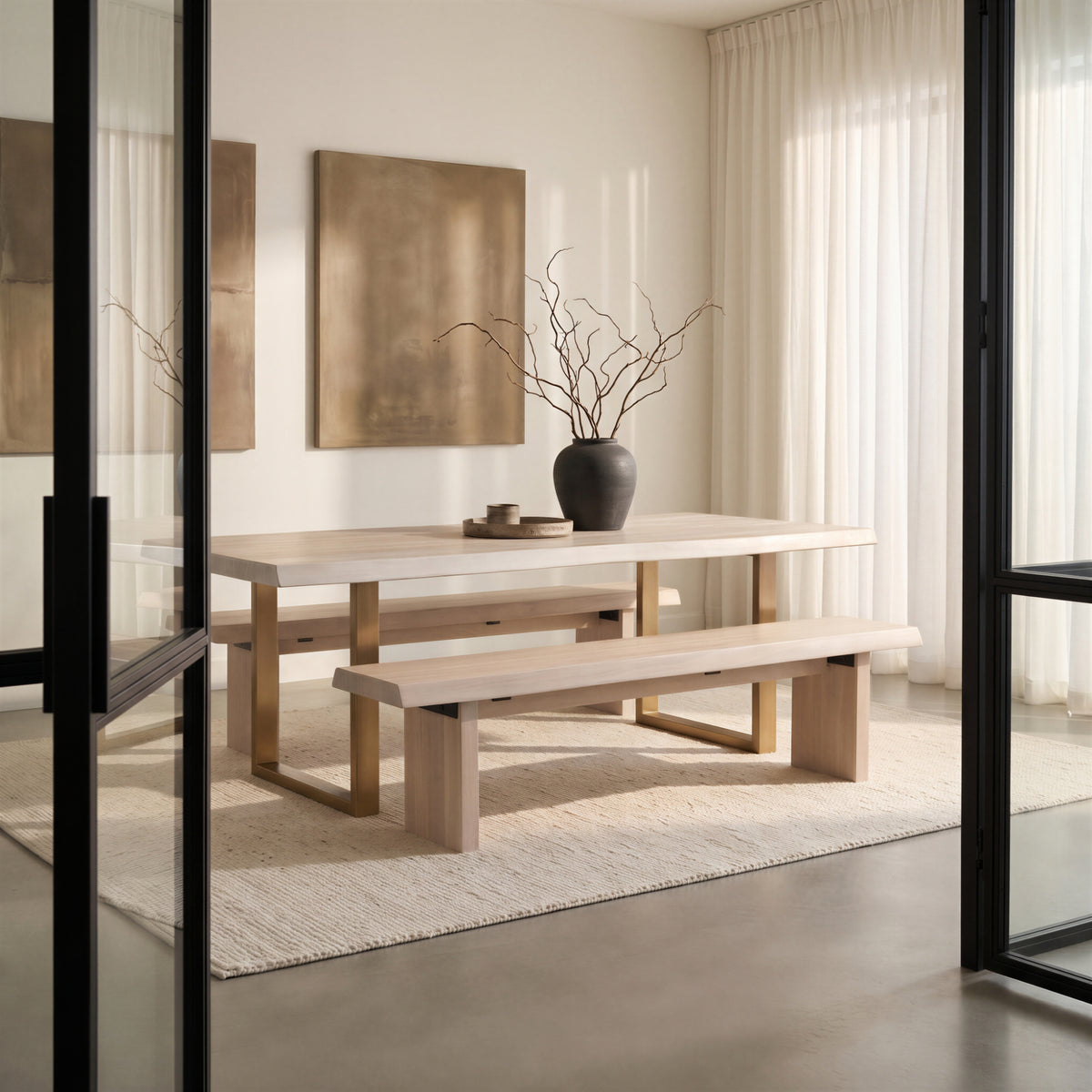 Brooks Dining Table - U Base by Urbia, wide in-room view with twin benches framed by a black doorway