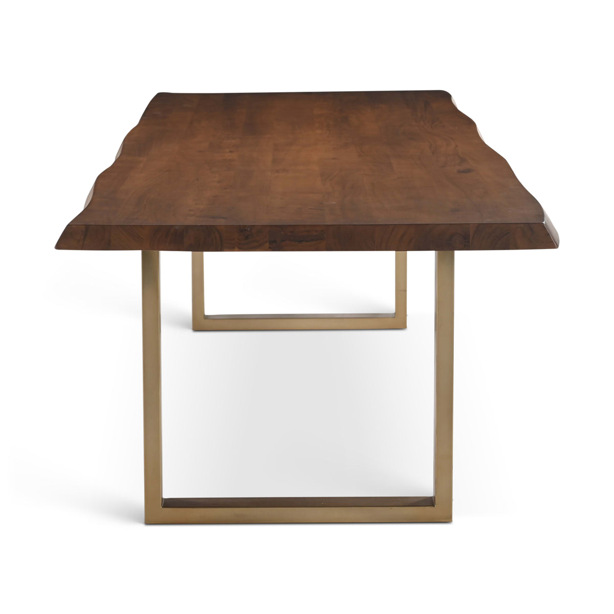 Brooks Dining Table - U Base by Urbia — end-on view of the warm-brown live-edge top and gold-toned U frame
