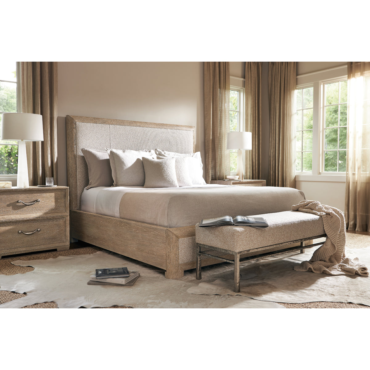 Aventura Upholstered Panel Bed by Bernhardt in a furnished bedroom, angled lifestyle view
