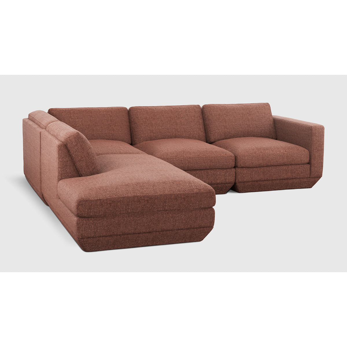 Podium Modular 4PC Lounge Sectional A by Gus* with rust-colored upholstery, angled view.