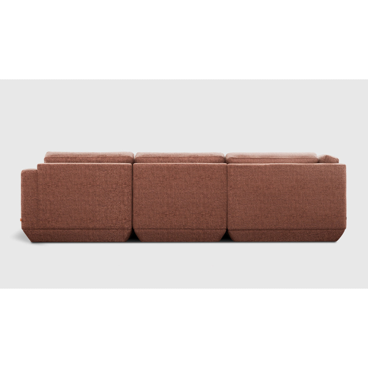 Podium Modular 4PC Lounge Sectional A by Gus* with rust-colored upholstery, straight rear view.