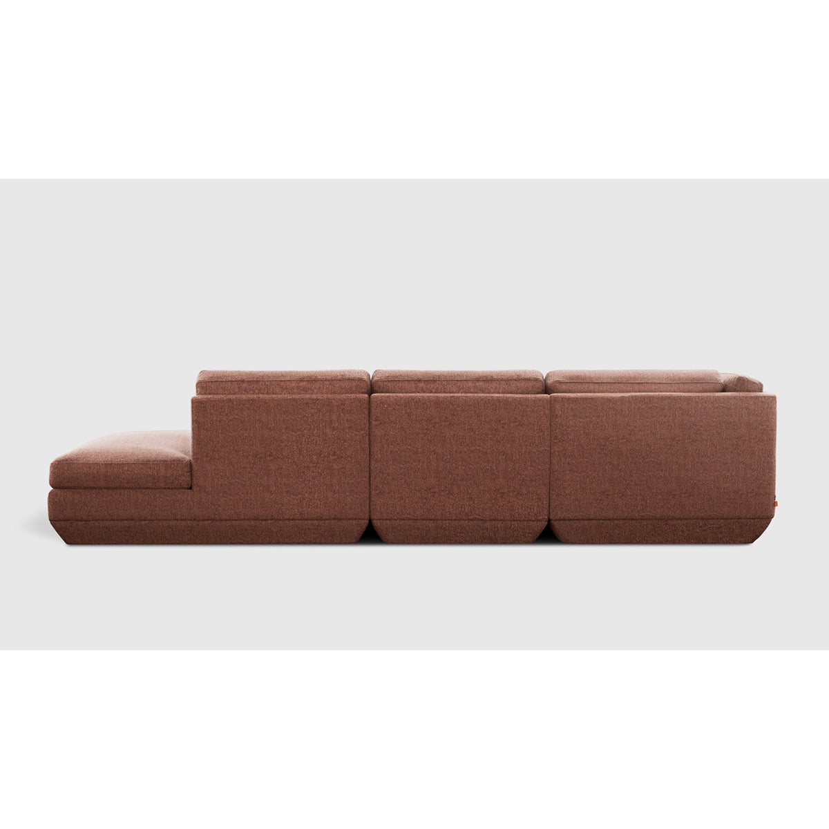 Podium Modular 4PC Lounge Sectional B - LF by Gus* — rust-brown upholstery, rear studio view
