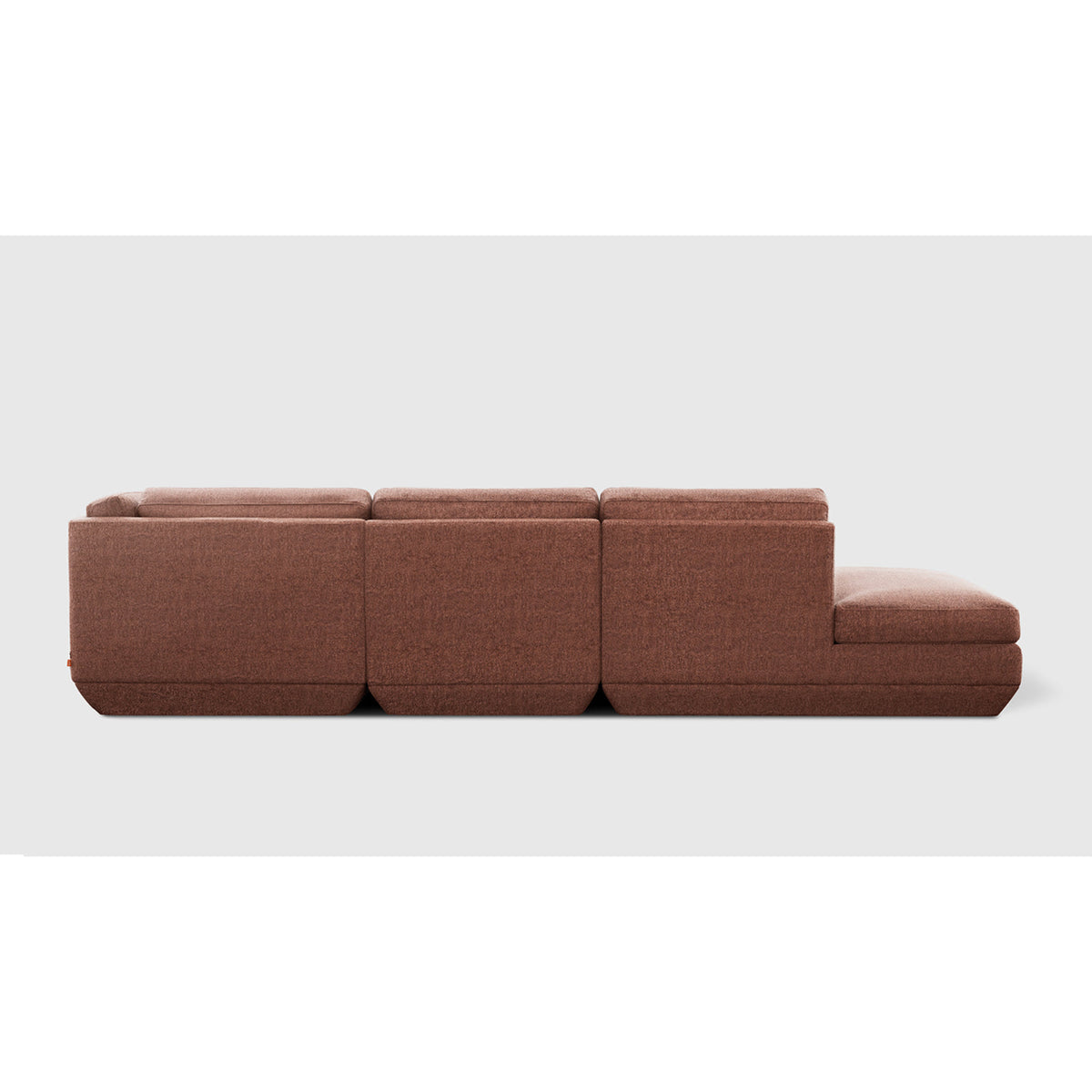 Podium Modular 4PC Lounge Sectional B - RF by Gus* — rust-brown upholstery, rear studio view