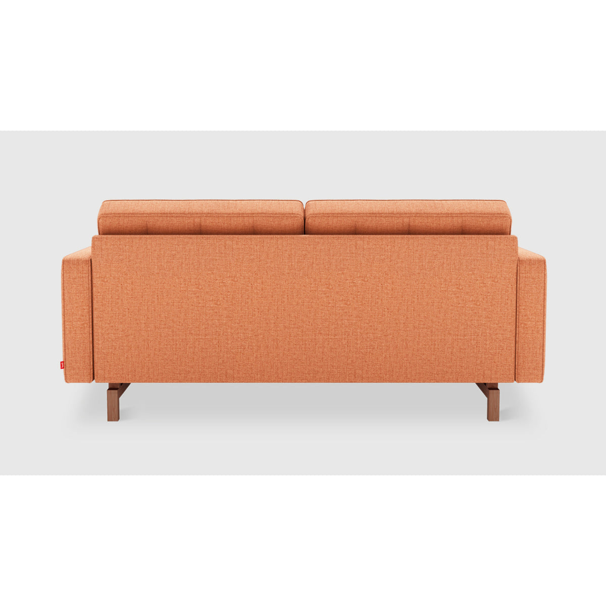 Jane 2 Loft Sofa by Gus* in warm orange upholstery, rear view showing the fully upholstered back and inset wood base