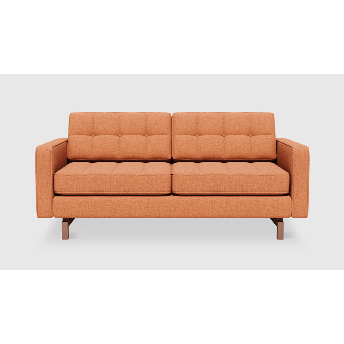 Jane 2 Loft Sofa by Gus* in warm orange upholstery, front view showing button-tufted cushions and piped edges