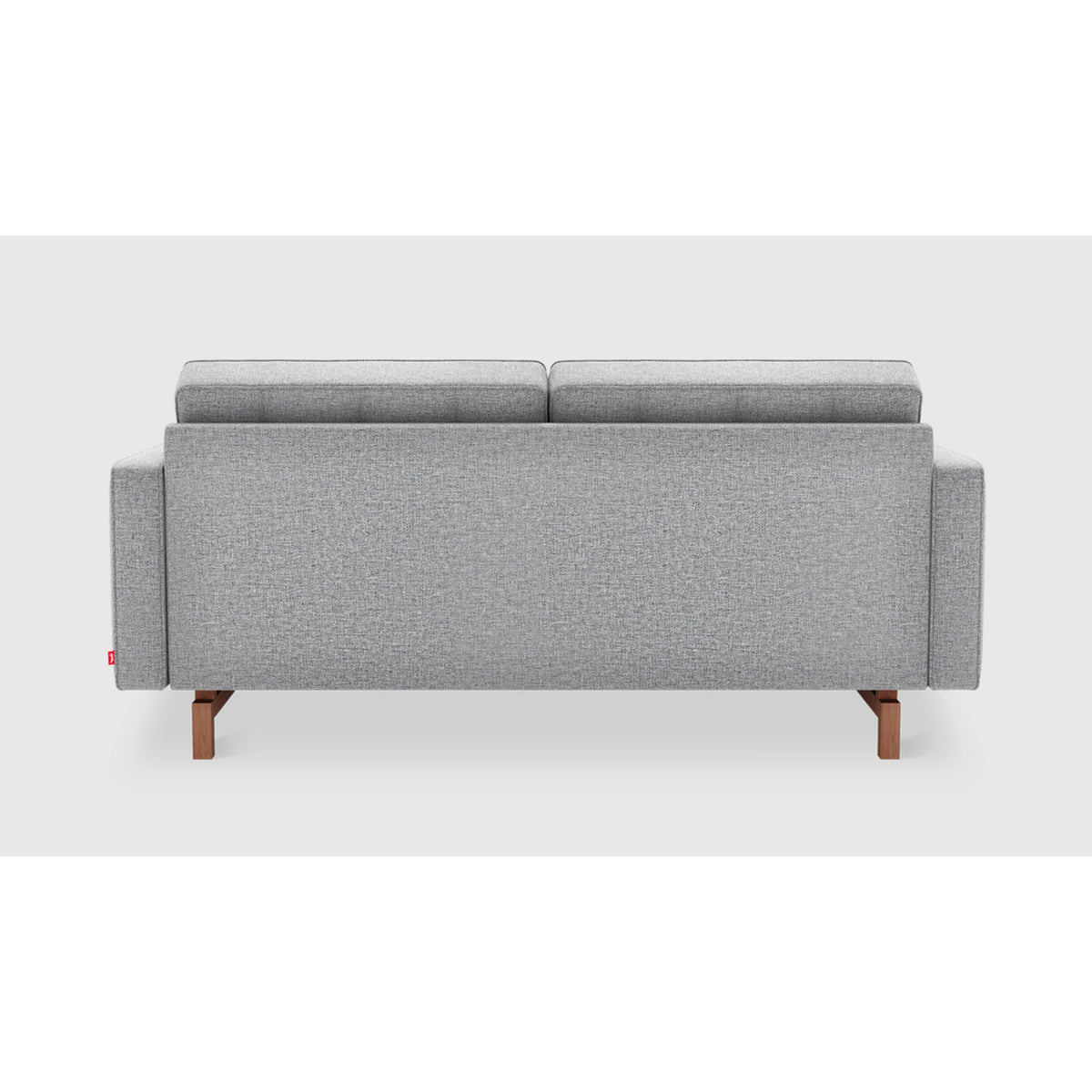 Jane 2 Loft Sofa by Gus* in gray upholstery, rear view showing the fully upholstered back and inset wood base