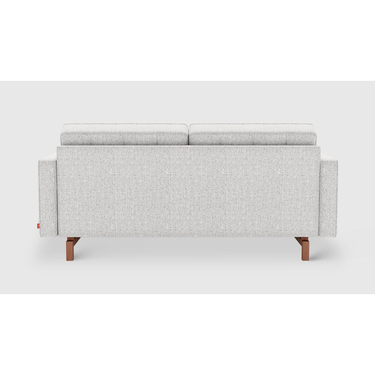 Jane 2 Loft Sofa by Gus* in light gray upholstery, rear view showing the fully upholstered back and inset wood base