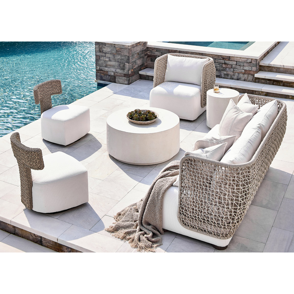 Cabo Outdoor Swivel Chair by Bernhardt in a poolside seating arrangement