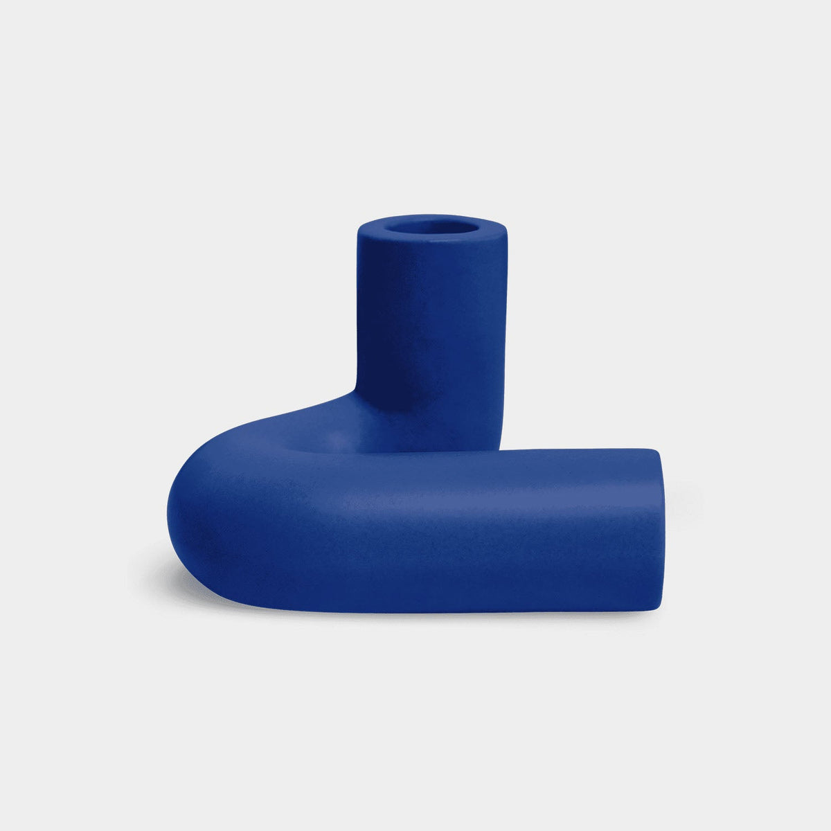 OCTAEVO Templo Candle Holder in blue — matte cast ceramic, side profile on a white background.